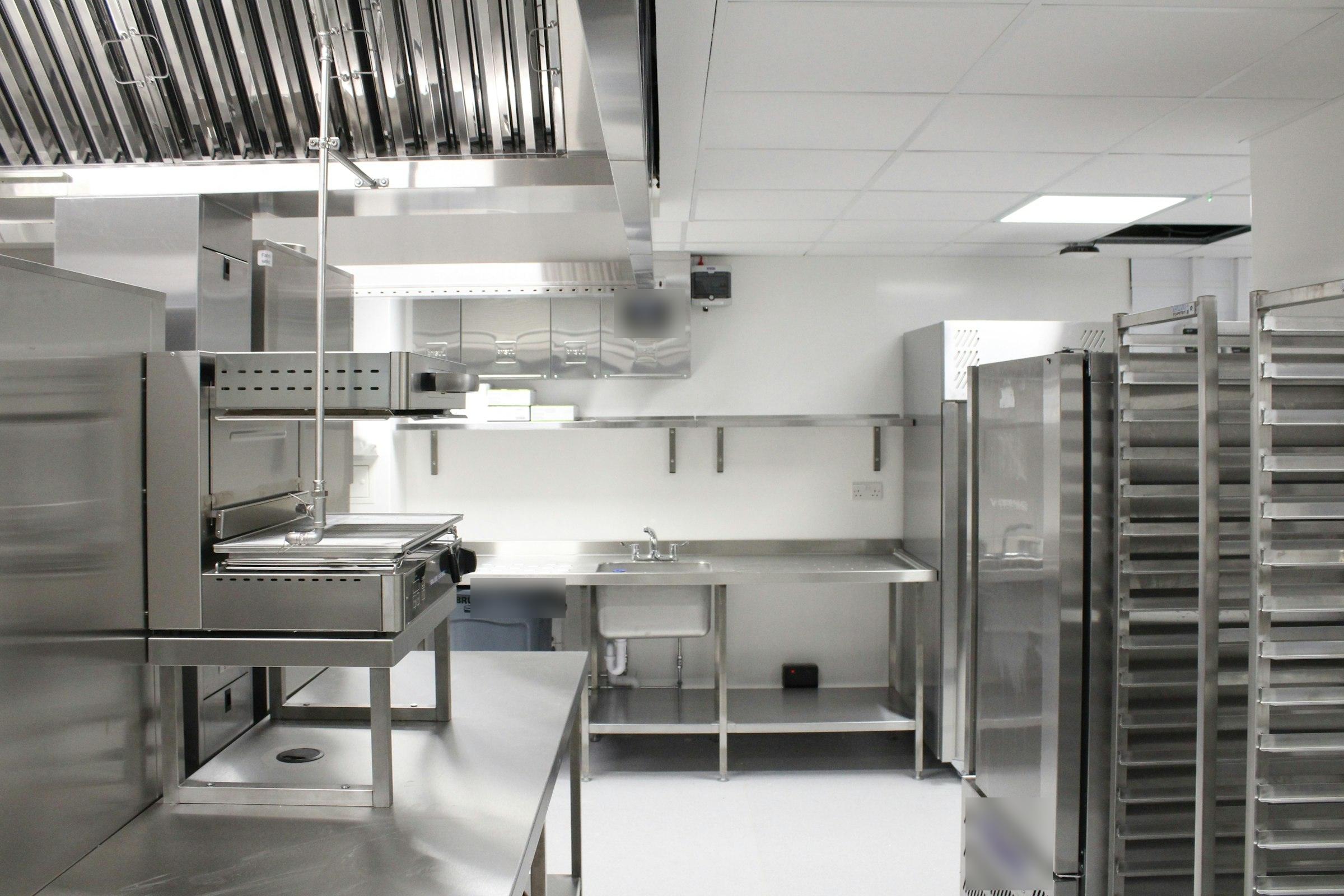 The 06:55 photo, framed so tightly it misses part of the prep counter and hand-wash sink
