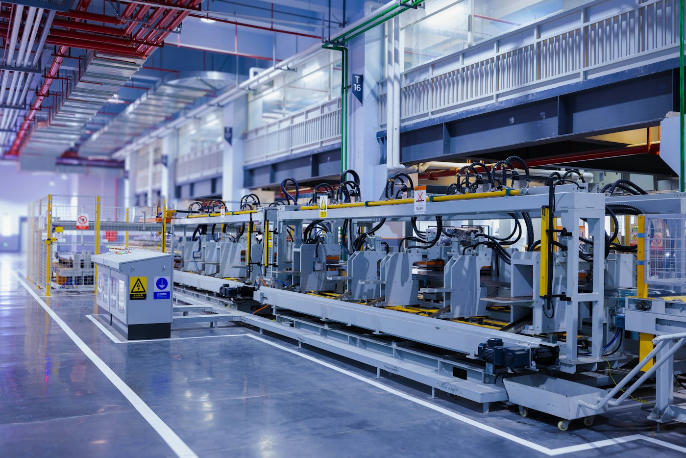 A factory production line beside a marked walkway