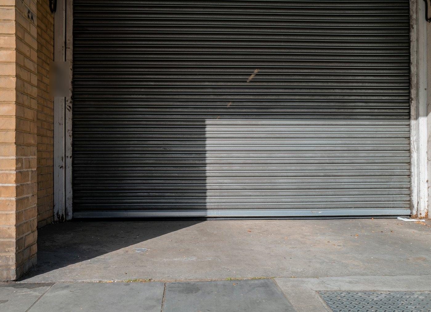 A closed roll-up shutter at a loading bay